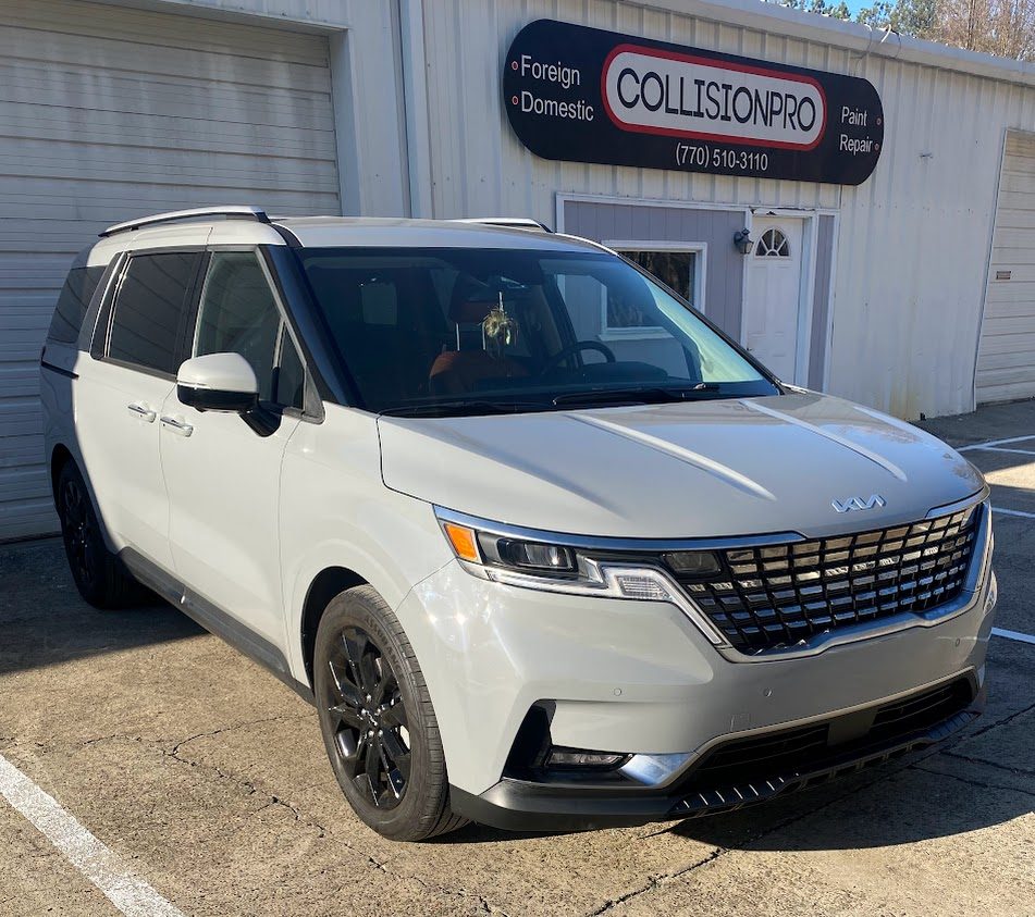 Finished minivan outside the shop
